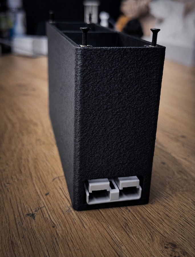 Black textured 3D-printed enclosure with clips